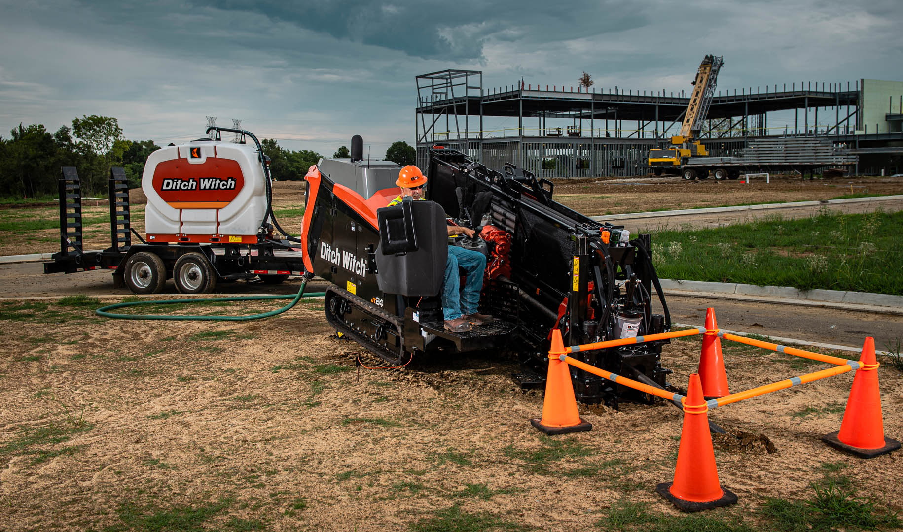 Ditch Witch JT24 horizontal directional drill operating on a marked construction site